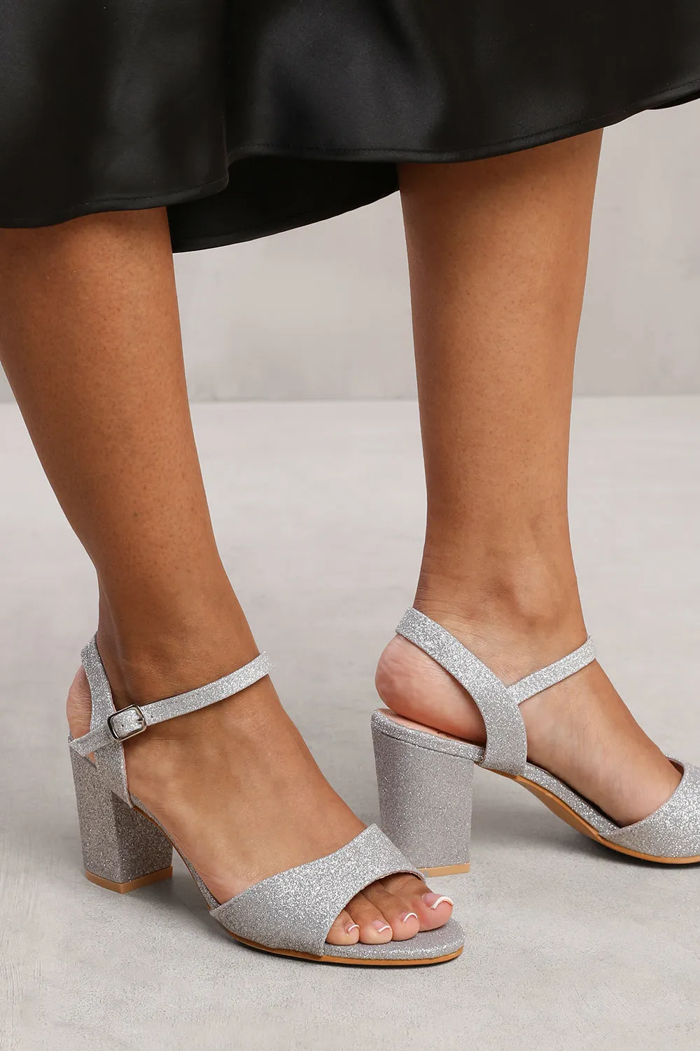 ELLA BUCKLE UP LOW BLOCK HEEL SANDAL IN SILVER